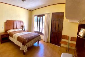 Postel nebo postele na pokoji v ubytování Posada Castillo
