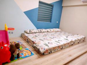 Postel nebo postele na pokoji v ubytování 霧台山豐民宿
