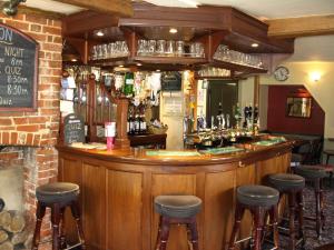 a bar with a lot of drinks on it at Jolly Brewers Free House Inn in Bishops Stortford