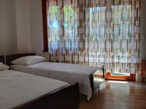 Ein Bett oder Betten in einem Zimmer der Unterkunft Appartamenti Estivi