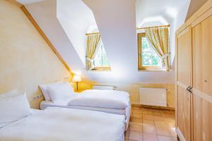 Vuode tai vuoteita majoituspaikassa Aux Tanneries de Wiltz