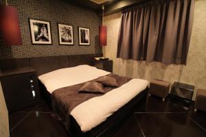 Ліжко або ліжка в номері Hotel K Omiya (Adult Only)