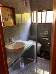 a bathroom with a sink and a toilet at STAY FUJI a in Yamanakako +35 photos