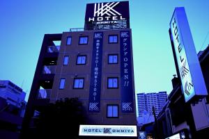 a building with a hotel sign on the side of it at Hotel K Omiya (Adult Only) in Saitama