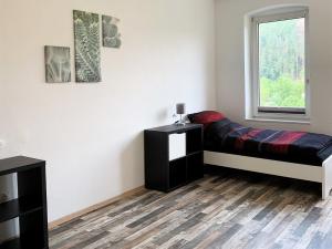 Postel nebo postele na pokoji v ubytování 3 Zimmerwohnung mit Garten