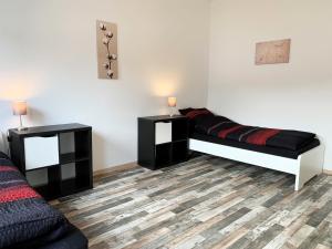Postel nebo postele na pokoji v ubytování 3 Zimmerwohnung mit Garten