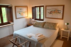 Postel nebo postele na pokoji v ubytování Casa Lattuada