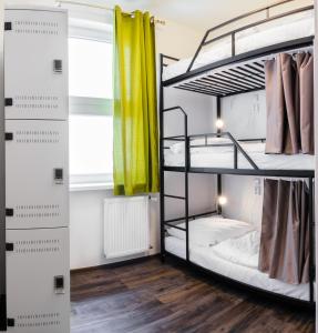 A bunk bed or bunk beds in a room at Hostel Mandarinka