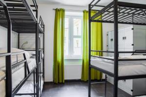Posteľ alebo postele v izbe v ubytovaní Hostel Mandarinka