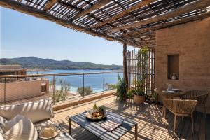a balcony with a view of the ocean at Six Senses Ibiza in Portinatx