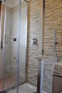 a shower with a glass door in a bathroom at Viale Repubblica 307 4 in Pietra Ligure +23 photos