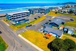 an aerial view of a city with a building and the ocean at OYO Waves Hotel Newport OR - NYE Beach in Newport