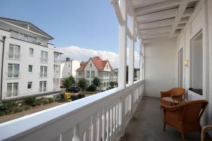 a balcony with a view of a city at Villa Seydlitz - by Rujana in Binz