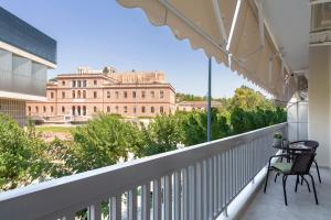 a balcony with a view of a large building at Acropolis View 2BD Apt next to Museum & Metro in Athens