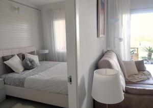 Posteľ alebo postele v izbe v ubytovaní Apartamentos Stil Mar Anna - L'Escala Stil Mar