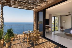a bedroom with a view of the ocean at Six Senses Ibiza in Portinatx