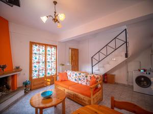 A seating area at Orange House for big families in Damouchari - Delicious Houses