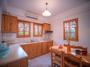 A kitchen or kitchenette at Orange House for big families in Damouchari - Delicious Houses
