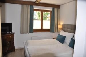 Een bed of bedden in een kamer bij Haus Florian Appartements