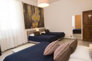 Postel nebo postele na pokoji v ubytování B&B 7 Rooms