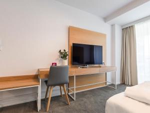 Televízia a/alebo spoločenská miestnosť v ubytovaní VacationClub – Seaside Apartament 451