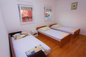 Ένα ή περισσότερα κρεβάτια σε δωμάτιο στο Apartments A&G