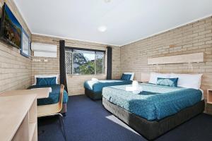 Imagen de la galería de Wunpalm Motel & Cabins - Late check-in available, en Maroochydore