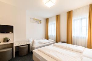 Postel nebo postele na pokoji v ubytování Hotel Wandinger Hof by Lehmann Hotels