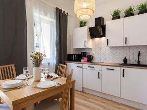Kuchyňa alebo kuchynka v ubytovaní VacationClub - Olymp Apartment 502A