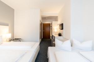 Postel nebo postele na pokoji v ubytování Hotel Wandinger Hof by Lehmann Hotels