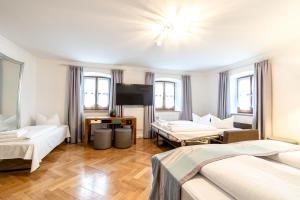 Postel nebo postele na pokoji v ubytování Hotel Wandinger Hof by Lehmann Hotels