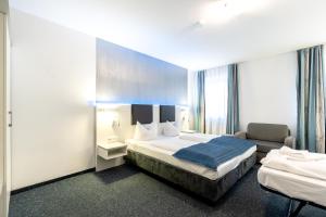 Postel nebo postele na pokoji v ubytování Hotel Wandinger Hof by Lehmann Hotels