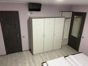 Postel nebo postele na pokoji v ubytování Guest House MAX