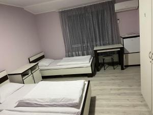 Postel nebo postele na pokoji v ubytování Guest House MAX