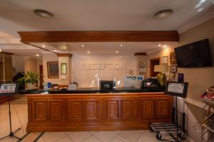 TV a/nebo společenská místnost v ubytování Best Western Plus Lido Hotel