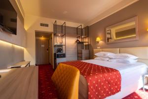 Postel nebo postele na pokoji v ubytování Best Western Plus Lido Hotel