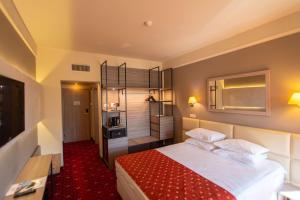 Postel nebo postele na pokoji v ubytování Best Western Plus Lido Hotel