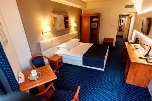 Postel nebo postele na pokoji v ubytování Best Western Plus Lido Hotel