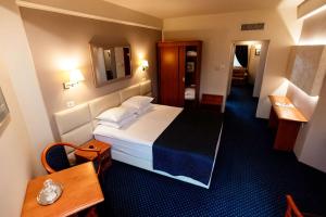 Postel nebo postele na pokoji v ubytování Best Western Plus Lido Hotel