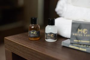 two bottles of hot sauce sitting on a table at Hotel Cara 28 in Skopje +36 photos