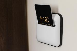 a sign that reads hrh hotel canada hanging on a door at Hotel Cara 28 in Skopje
