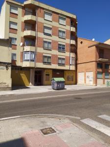 an empty street in front of a building at Galicia47 in Zamora