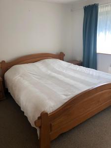 Uma cama ou camas num quarto em Appartement De Brink