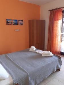Postel nebo postele na pokoji v ubytování Pyrgadikia Paradise