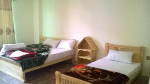 Ένα ή περισσότερα κρεβάτια σε δωμάτιο στο Hotel Mi-Amore