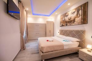 Posteľ alebo postele v izbe v ubytovaní LA DOLCE VITA ROOMS