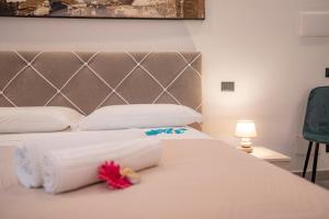 Posteľ alebo postele v izbe v ubytovaní LA DOLCE VITA ROOMS