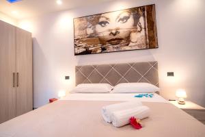 Posteľ alebo postele v izbe v ubytovaní LA DOLCE VITA ROOMS