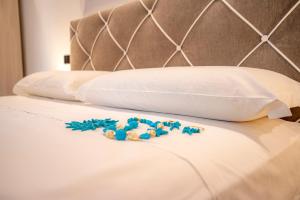 Posteľ alebo postele v izbe v ubytovaní LA DOLCE VITA ROOMS