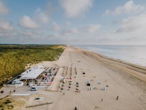 an overhead view of a beach with a crowd of people at Joy at the Beach in Zandvoort